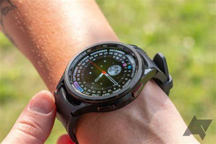Samsung Galaxy Watch 4 Info Brick Face A Samsung Galaxy Watch 4 on a leather surface displays the watch face Info Brick.