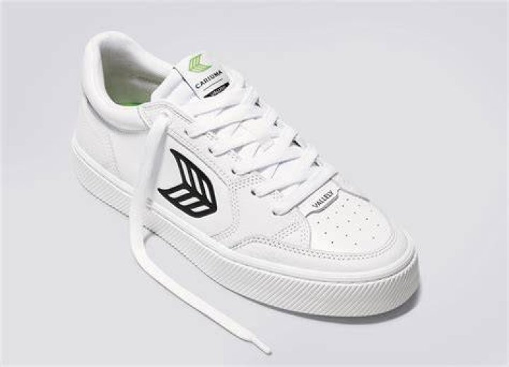 A white Cariuma sneaker with black detailing