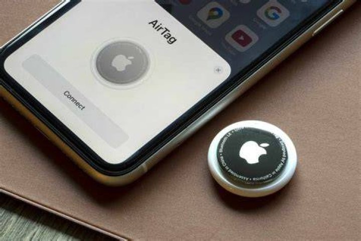 Apple AirTag in hand Apple AirTag best bluetooth tracker