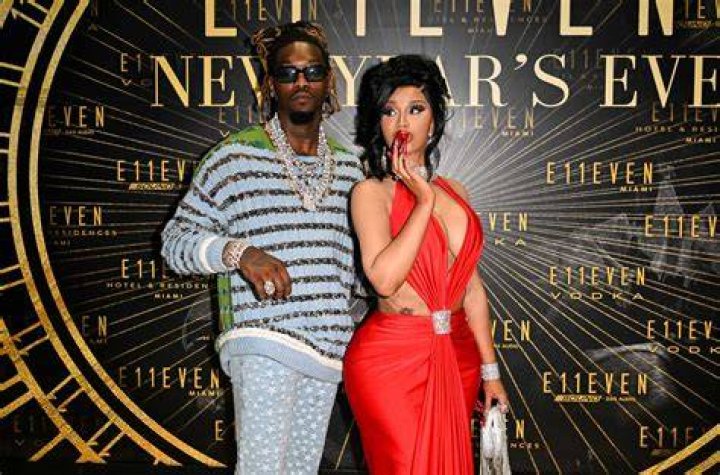 Cardi B and Offset on a red carpet.