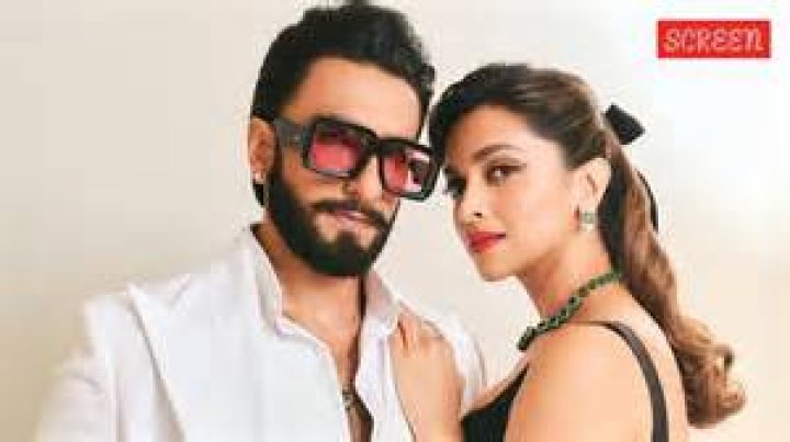 Deepika Padukone with a movie clapperboard Deepika Padukone with a movie clapperboard