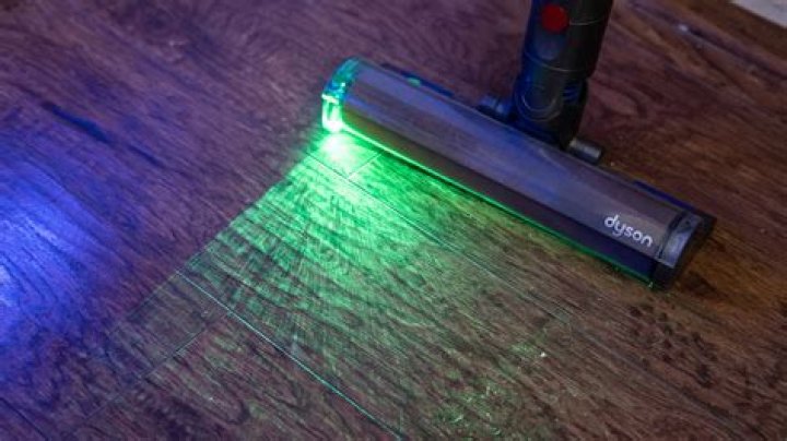 Dyson V15 Detect showing front with laser on Dyson V15 Detect showing front with laser on