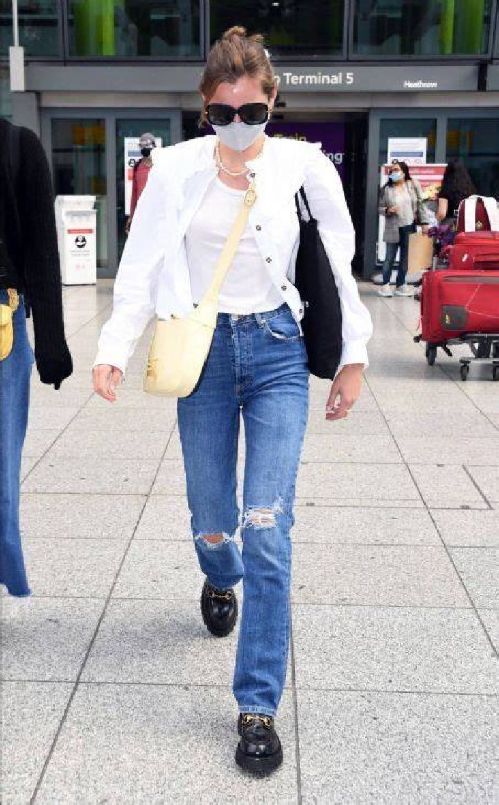 Emma Corrin seen leaving her hotel with a mystery man during the 77th