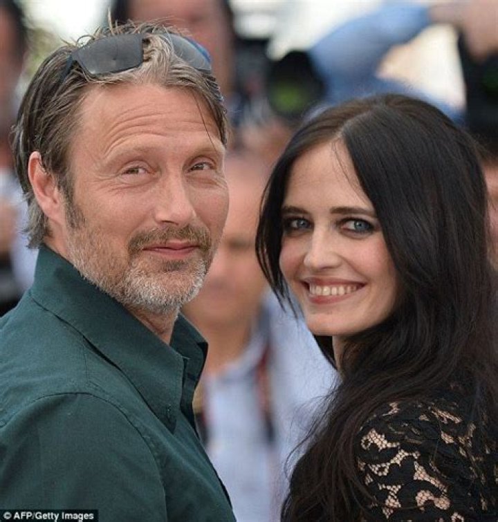 Eva Green highlights her lithe frame in lacy black jumpsuit as she