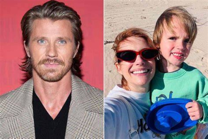 Garrett Hedlund holding son Rhodes in a store.