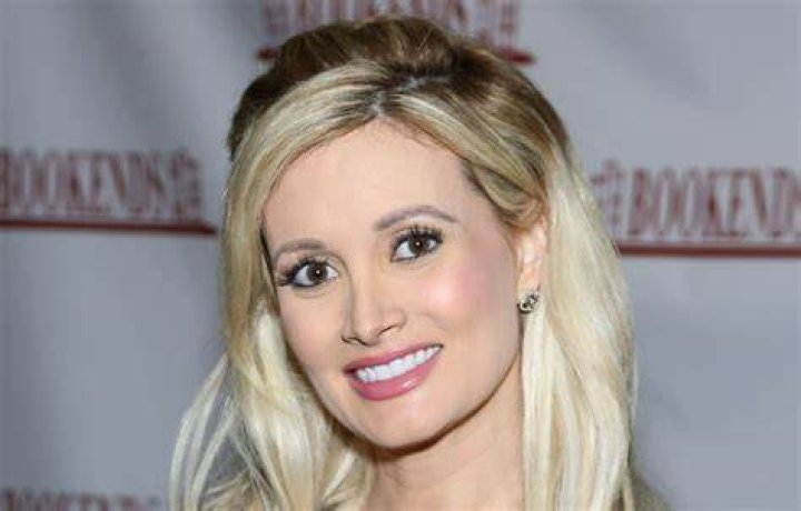Holly Madison puts on a leggy display in highwaisted white shorts as she arrives at LA studio