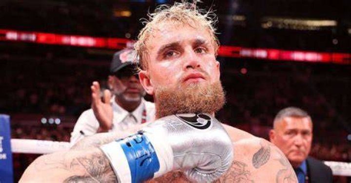 Jake Paul taking a video of himself while boxing.