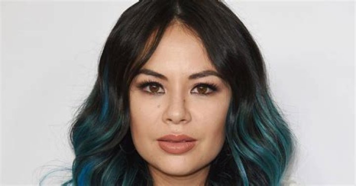 Janel Parrish looking serious