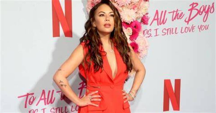 Janel Parrish wearing a red dress