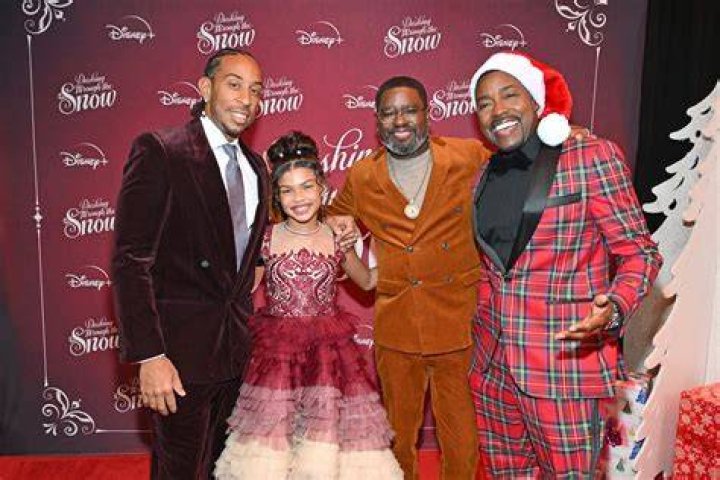 Madison Skye Validum and Chris 'Ludacris' Bridges chase after Lil Rel Howery in a still from 'Dashing Through the Snow'