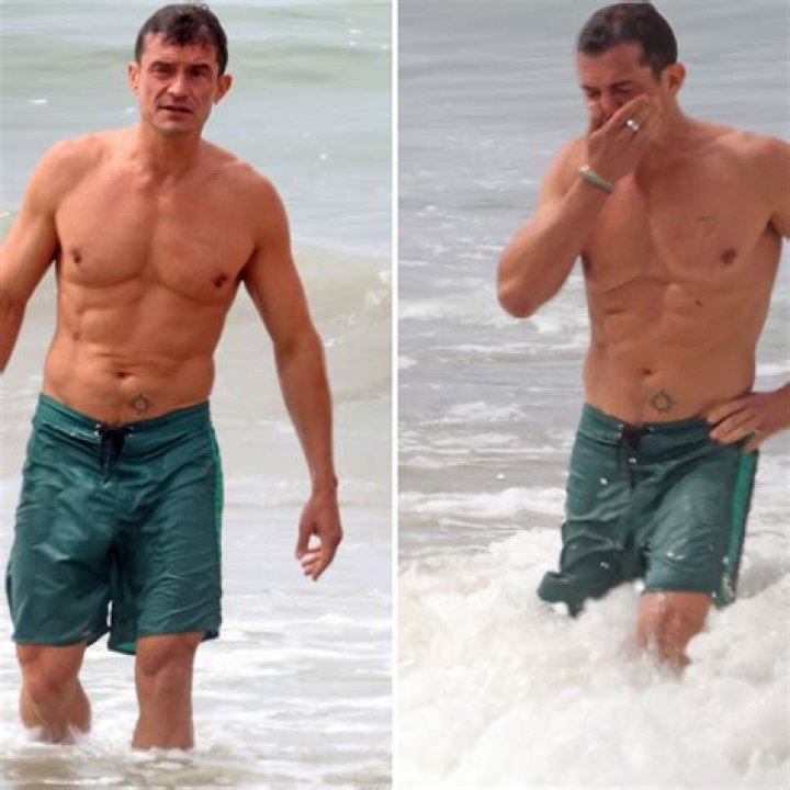 Orlando Bloom Shows Off Buff Physique During a Beachside Swim