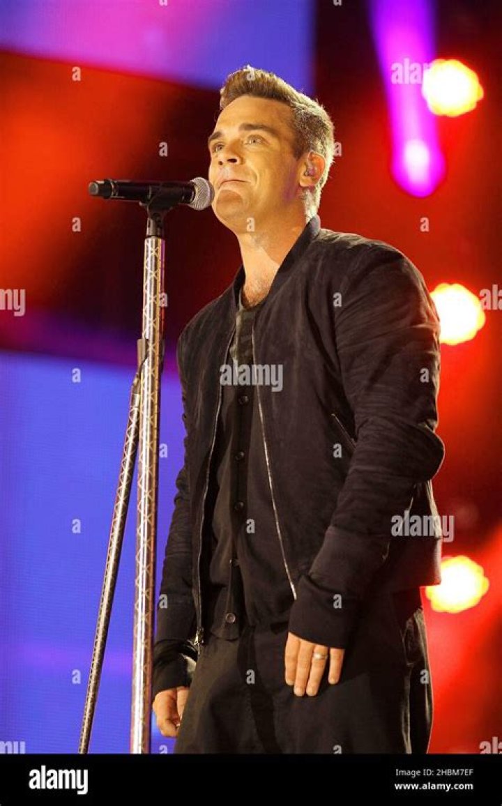 Robbie Williams performs on stage Robbie Williams performs on stage