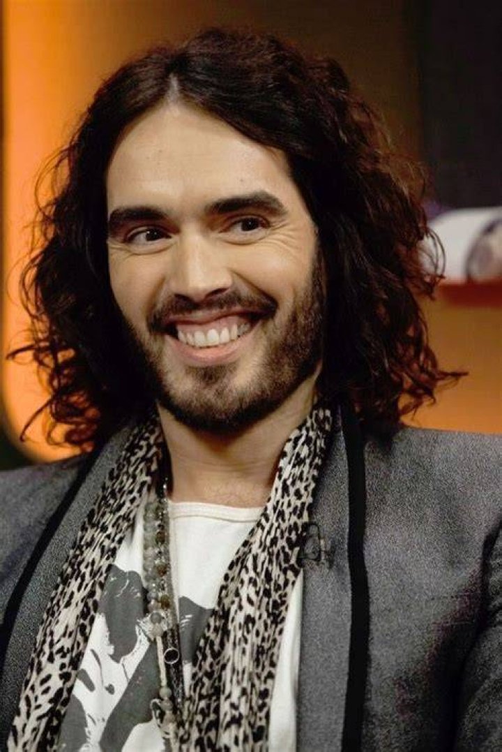 Russell Brand smiling outside