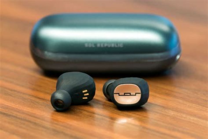 Sol Republic Amps Air + true wireless earbuds in black on gray background.