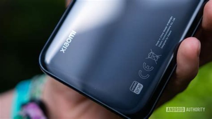 Xiaomi Mi A3 Chassis rear view in hand branding and Android One logo Xiaomi Mi A3 Chassis rear view in hand branding and Android One logo