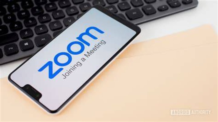 Zoom Meetings on smartphone next to office equipment stock 6 Zoom Meetings on smartphone next to office equipment stock 6
